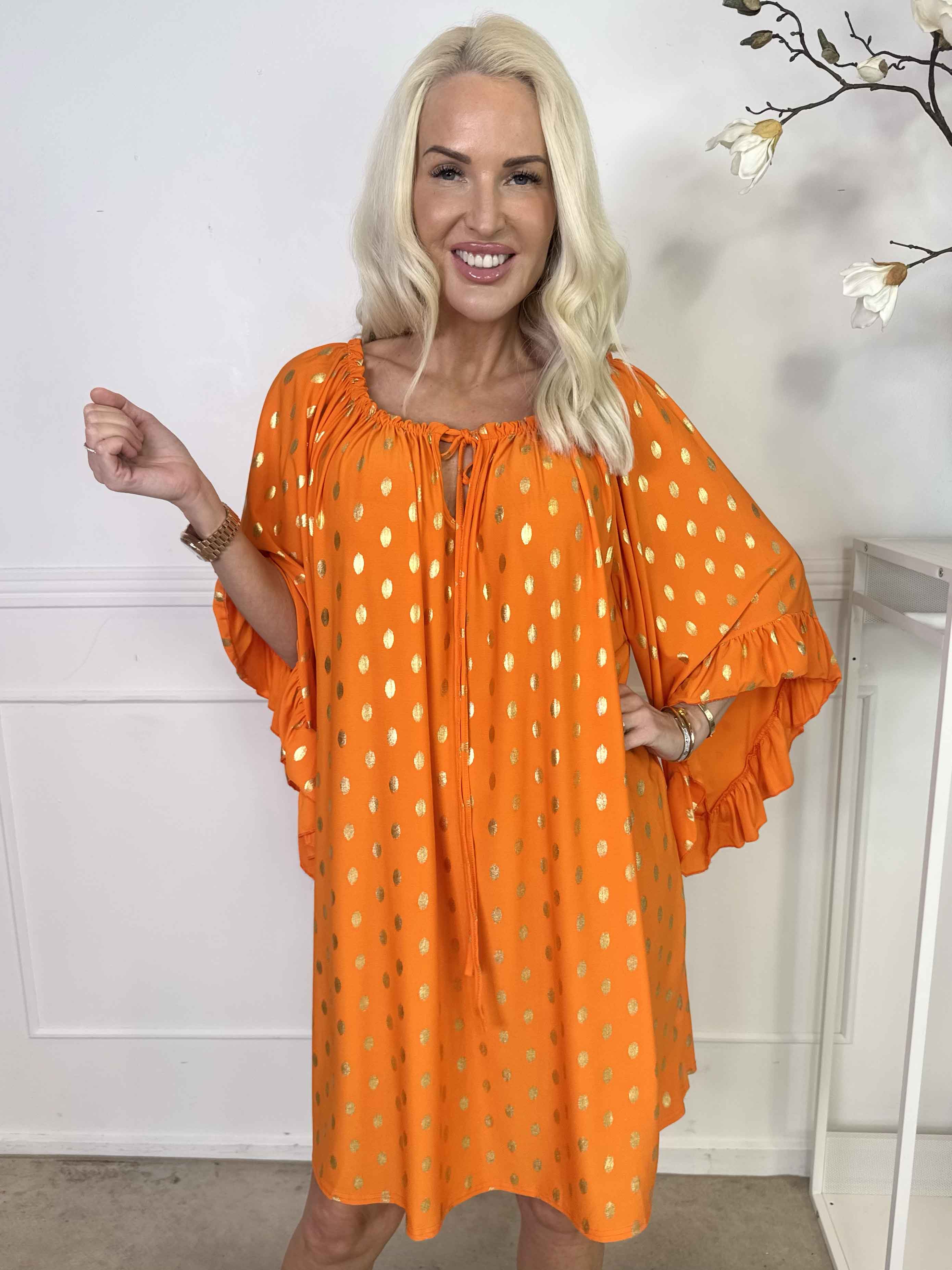 Yasma - Elastisk tunikaklänning med guldprickar och volangärmar